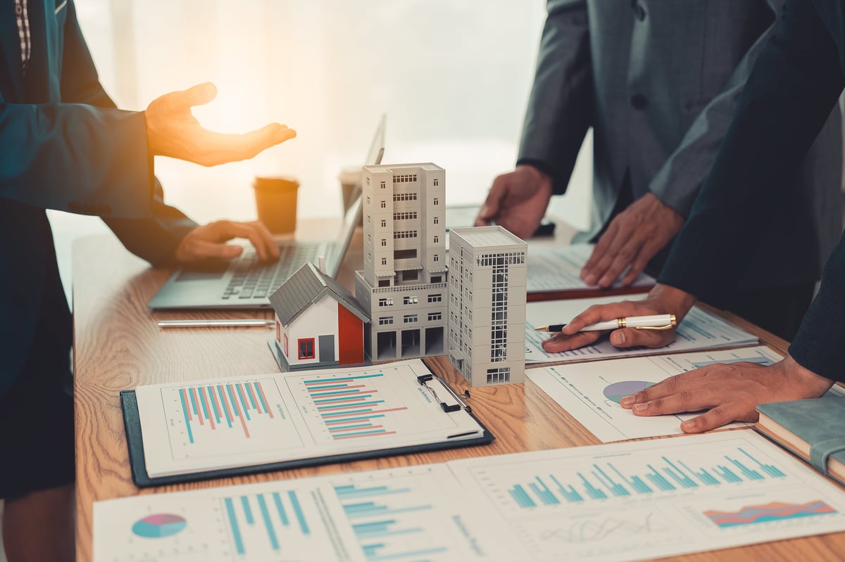 Real estate entrepreneurs meeting to discuss a property deal